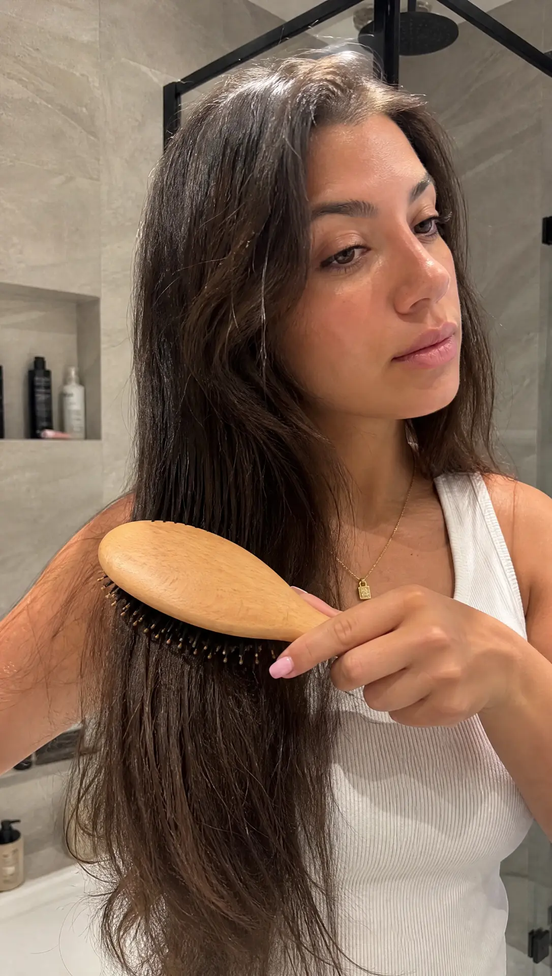 Woman brushing her hair with the Seralie SilkBrush™
